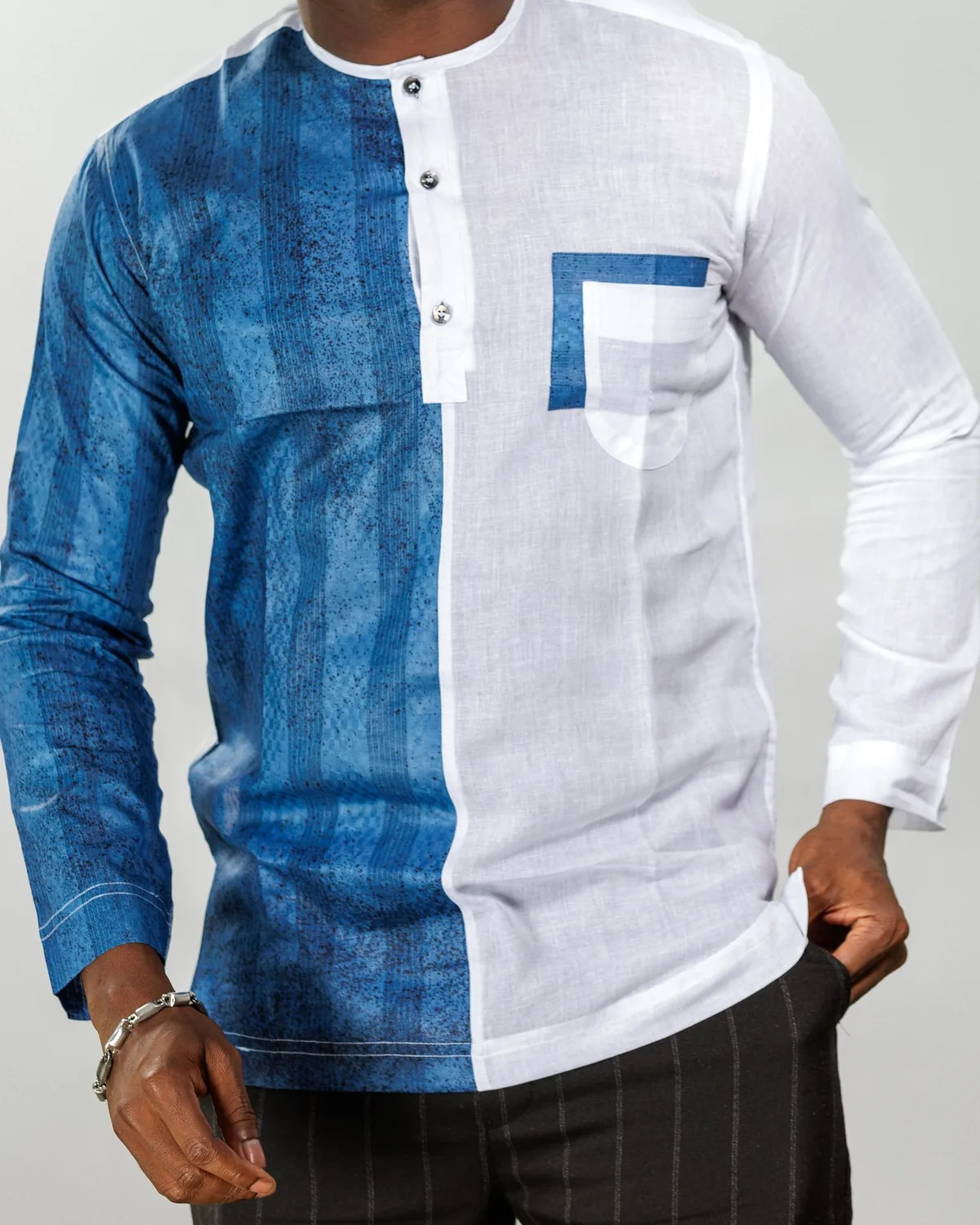 Long-sleeve band-collar shirt with a printed blue panel, a white linen-look panel and a chest pocket, shown from the neck down
